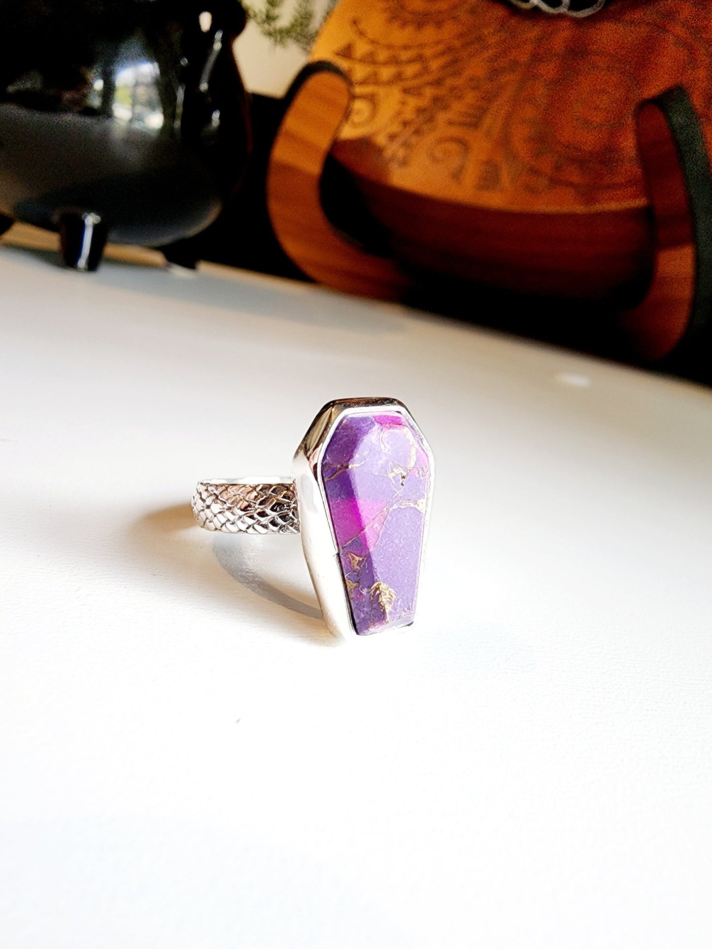 Purple with gold speckled coffin stone shaped ring with snakeskin like textured band