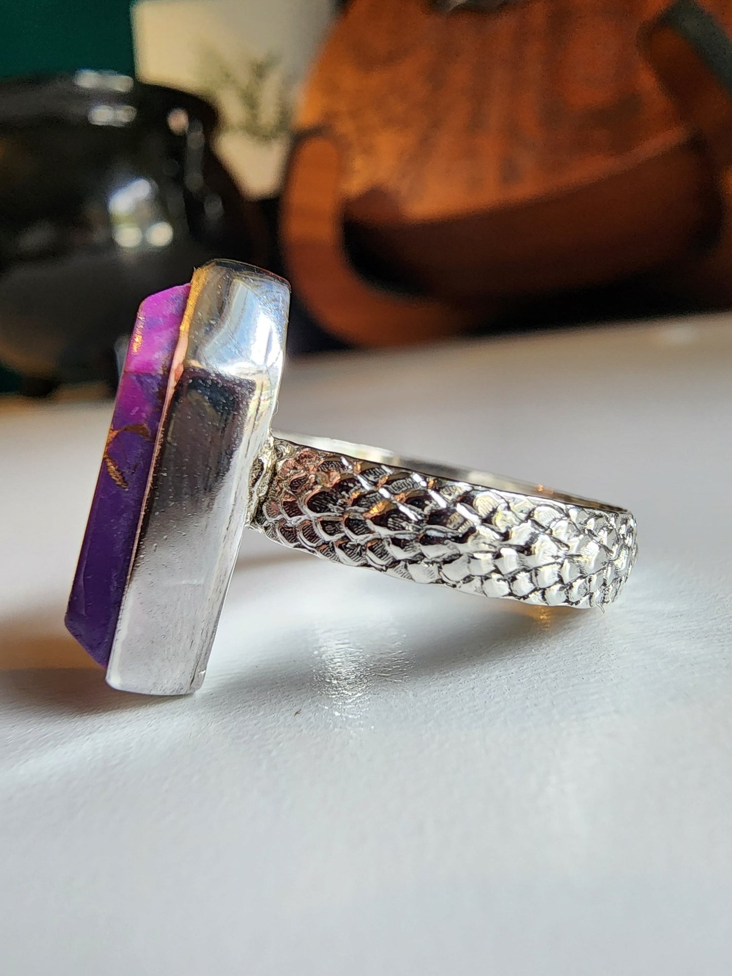 Purple with gold speckled coffin stone shaped ring with snakeskin like textured band