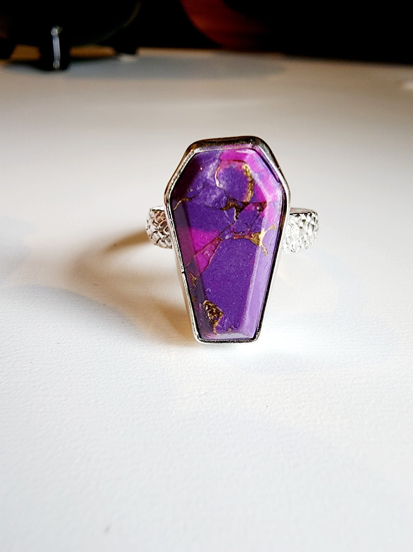 Purple with gold speckled coffin stone shaped ring with snakeskin like textured band