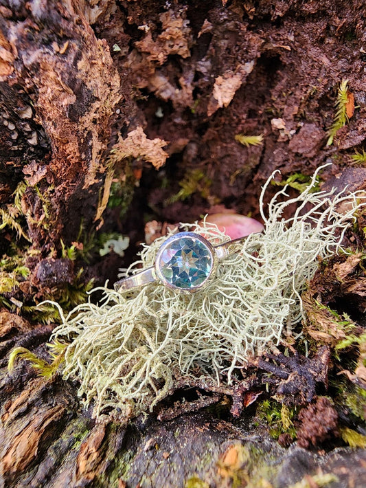 blue single solitaire set ring with silver band