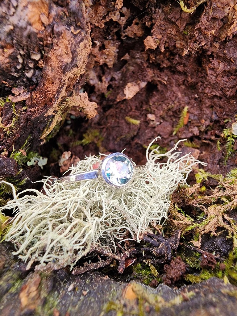 blue single solitaire set ring with silver band