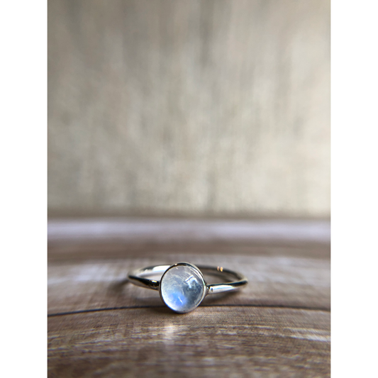 small moonstone ring with simple band. Bezel set.