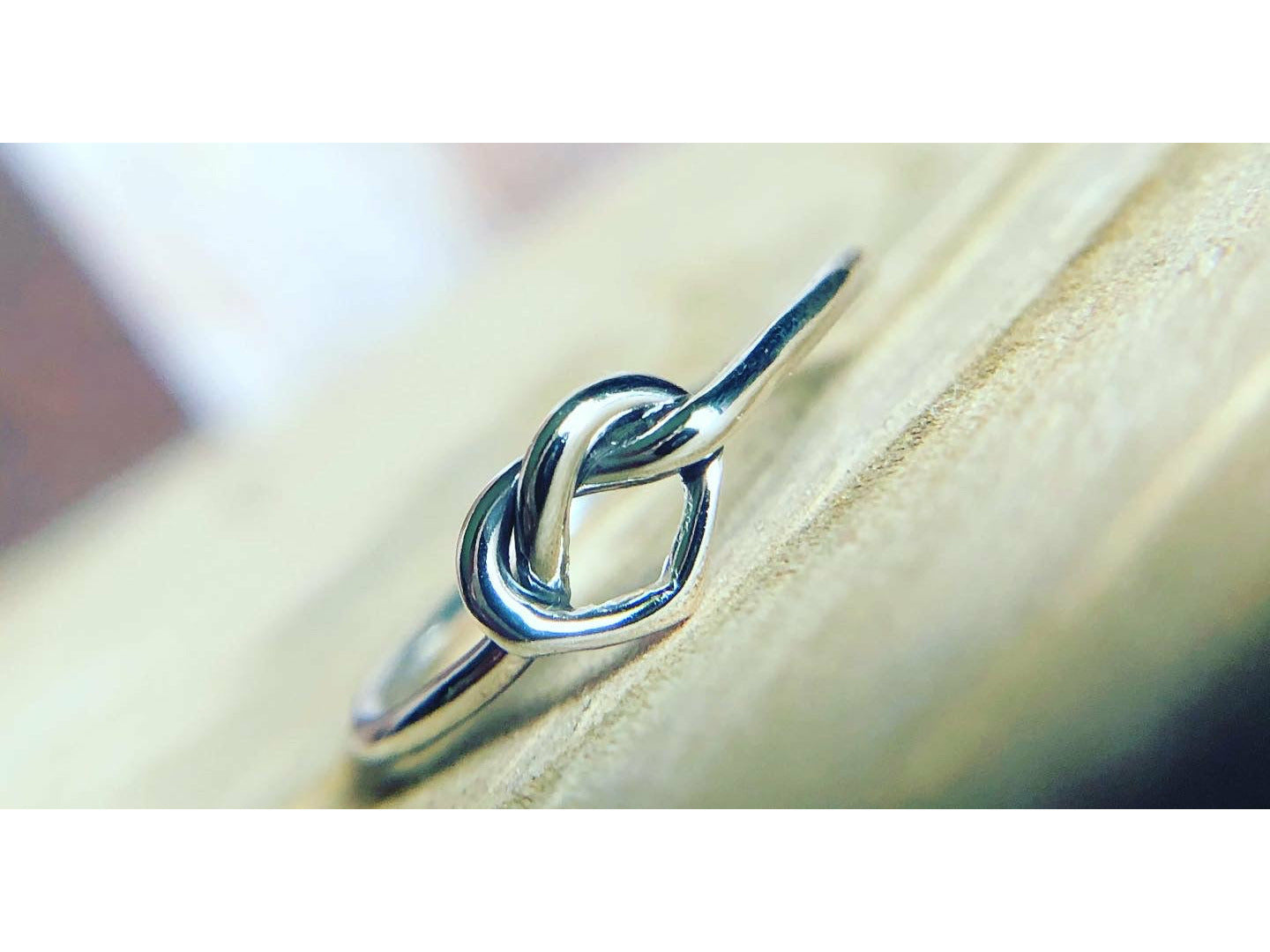small heart formed out of silver, one continous piece of silver.