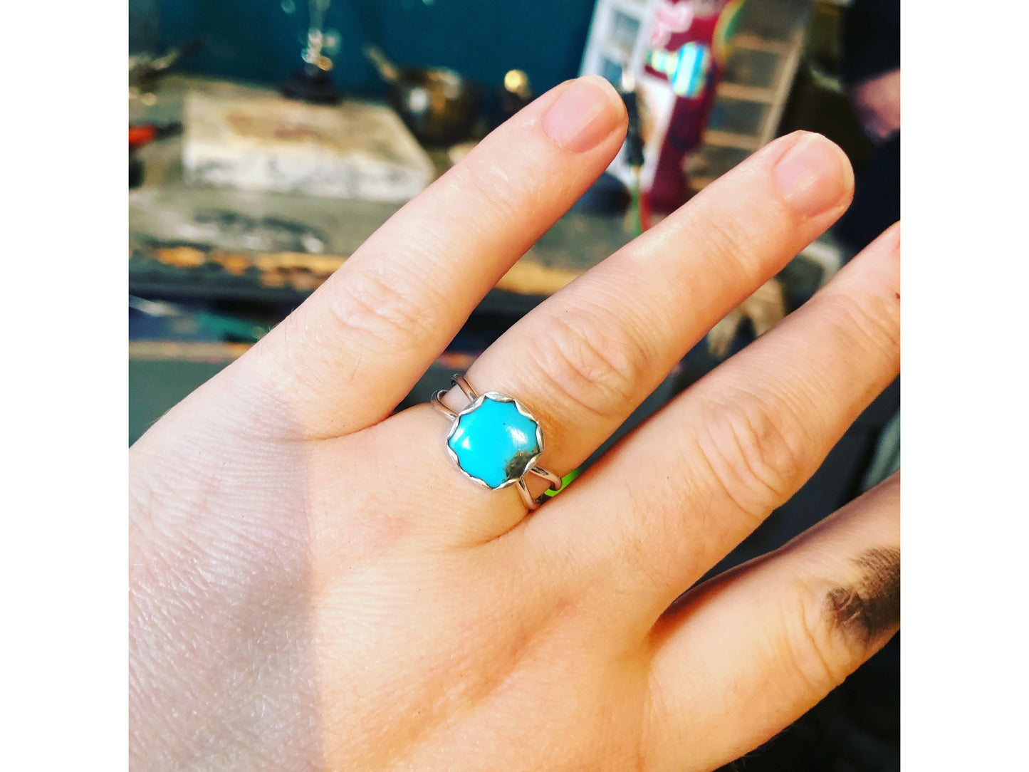 Small turquoise ring with square shaped stone.