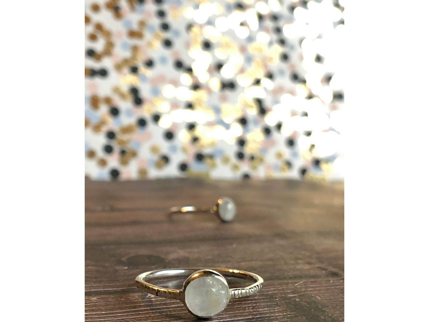 small moonstone ring with simple band. Bezel set.