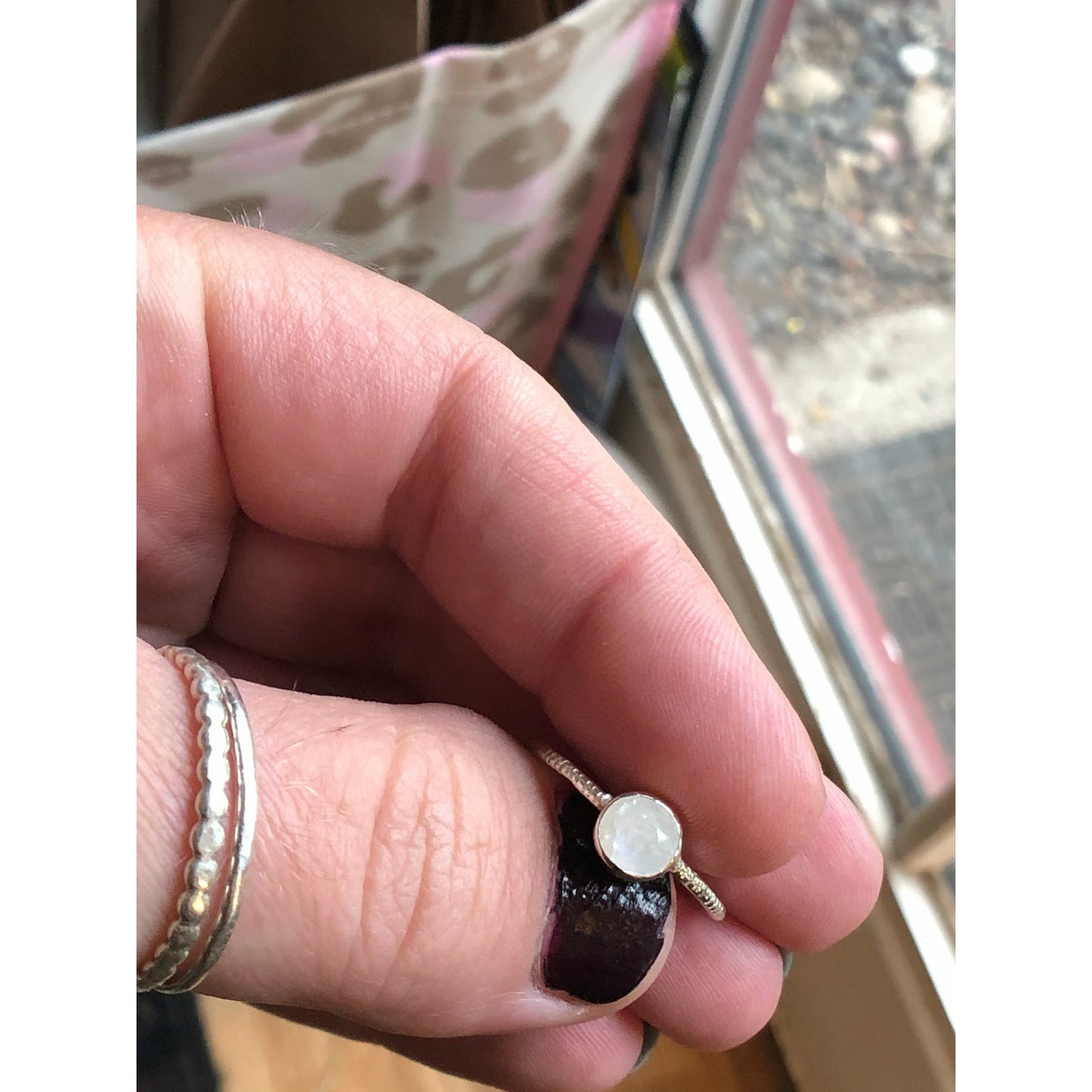 small moonstone ring with simple band. Bezel set.