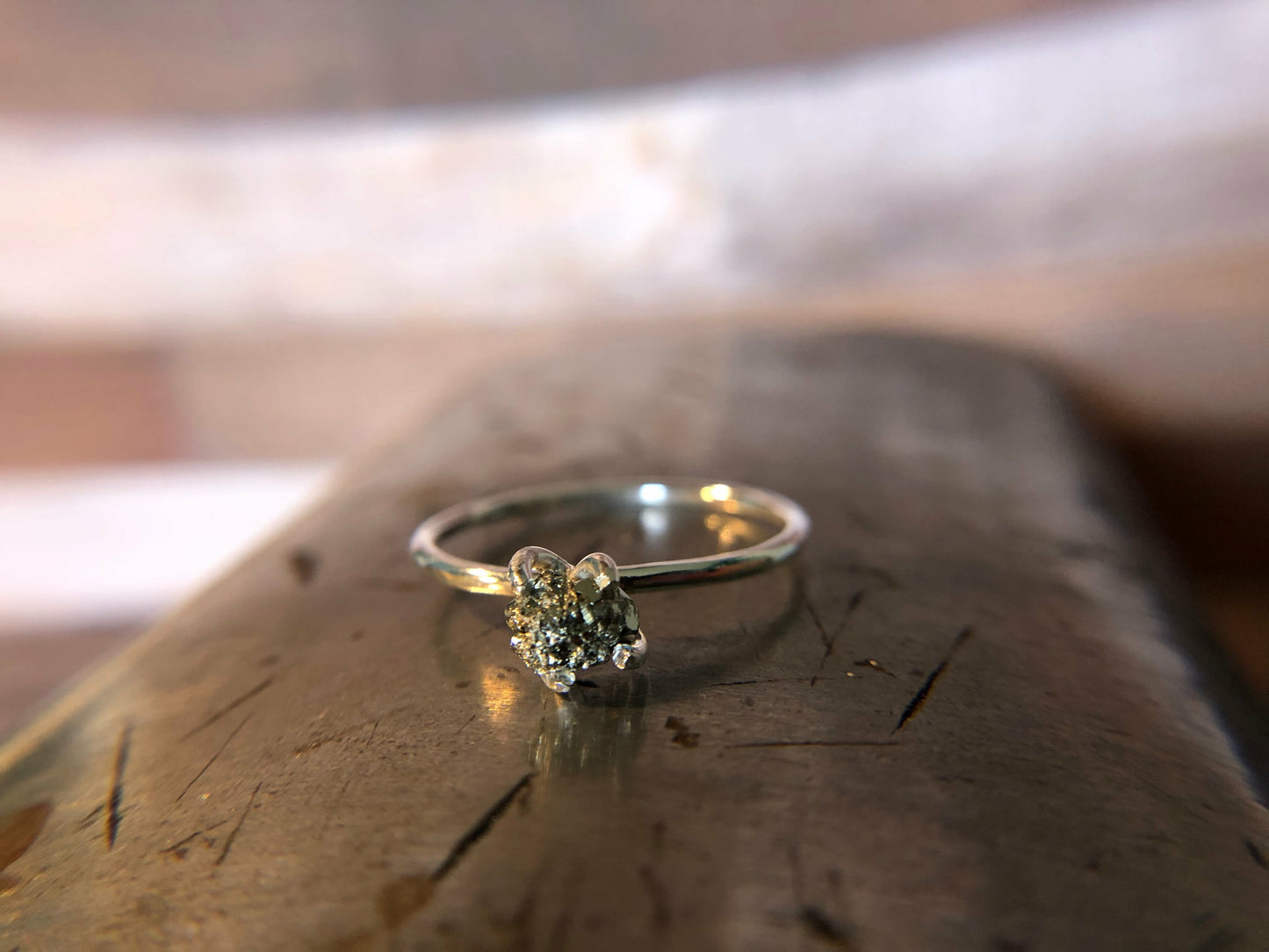 Small single band ring with raw pyrite prong set