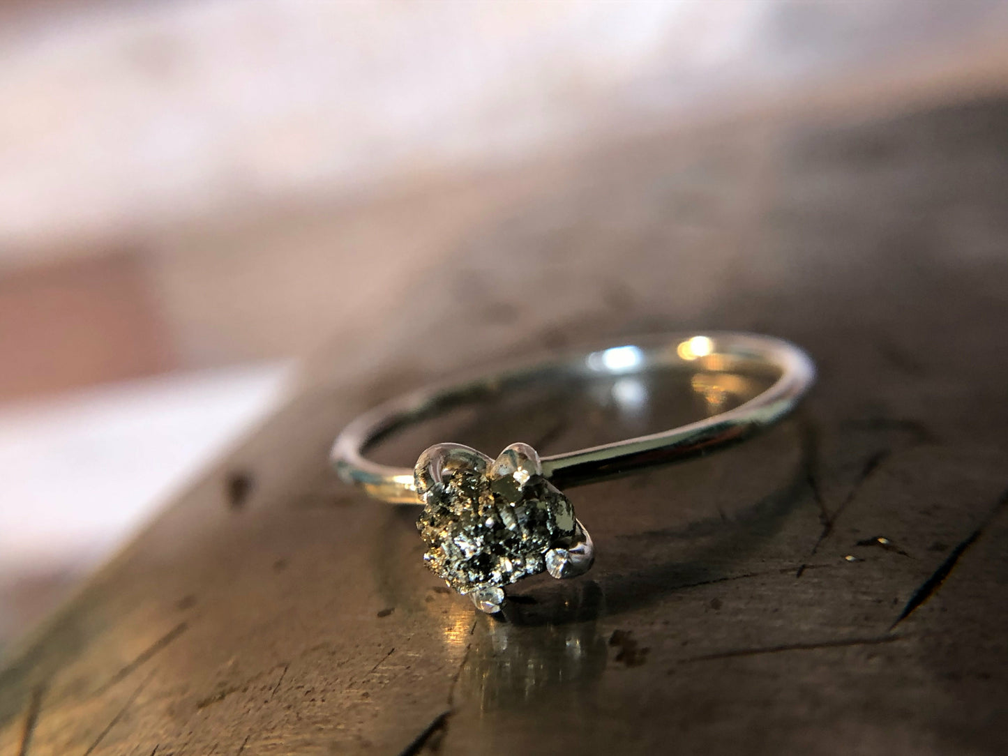 Small single band ring with raw pyrite prong set