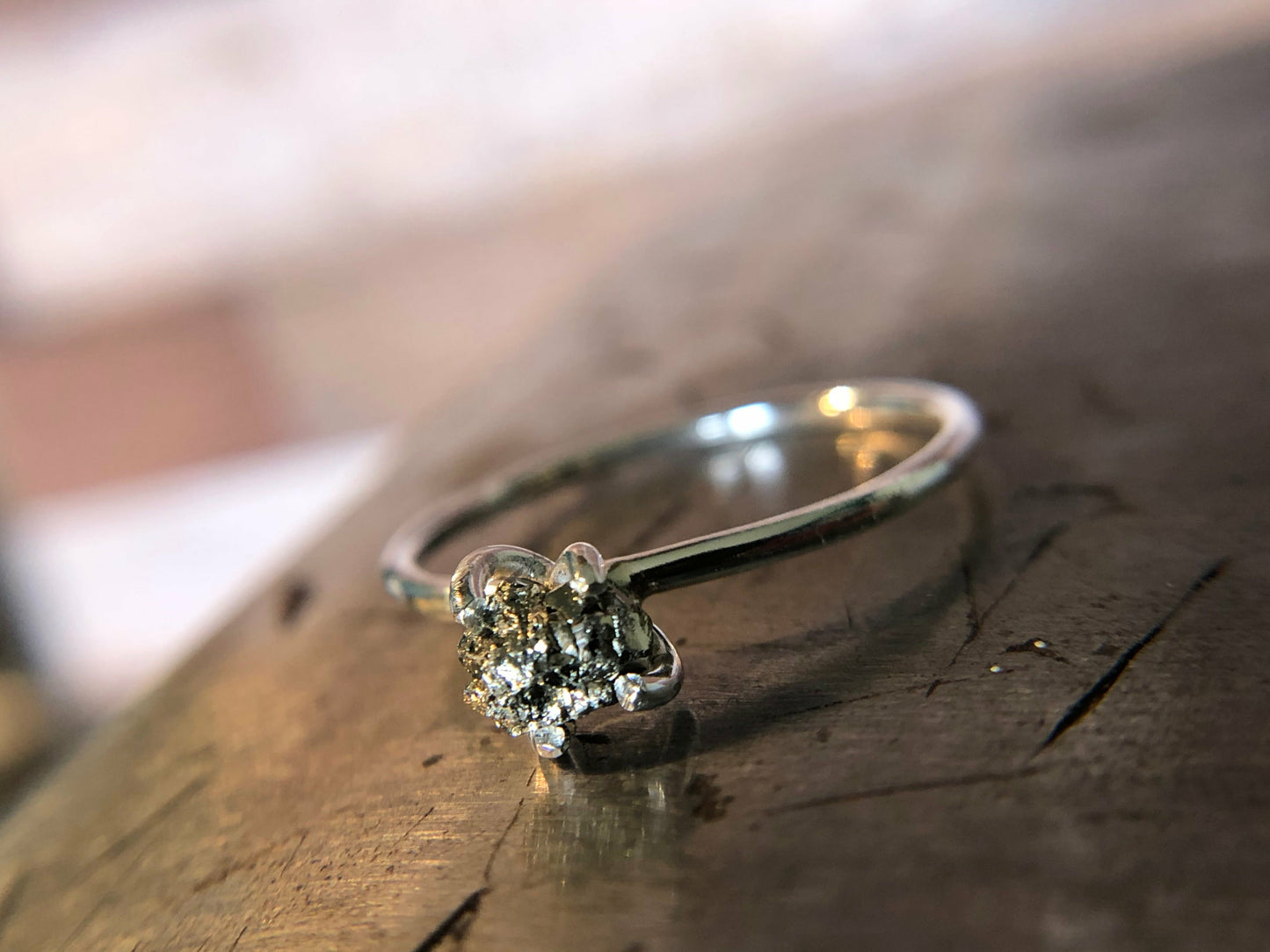 Small single band ring with raw pyrite prong set