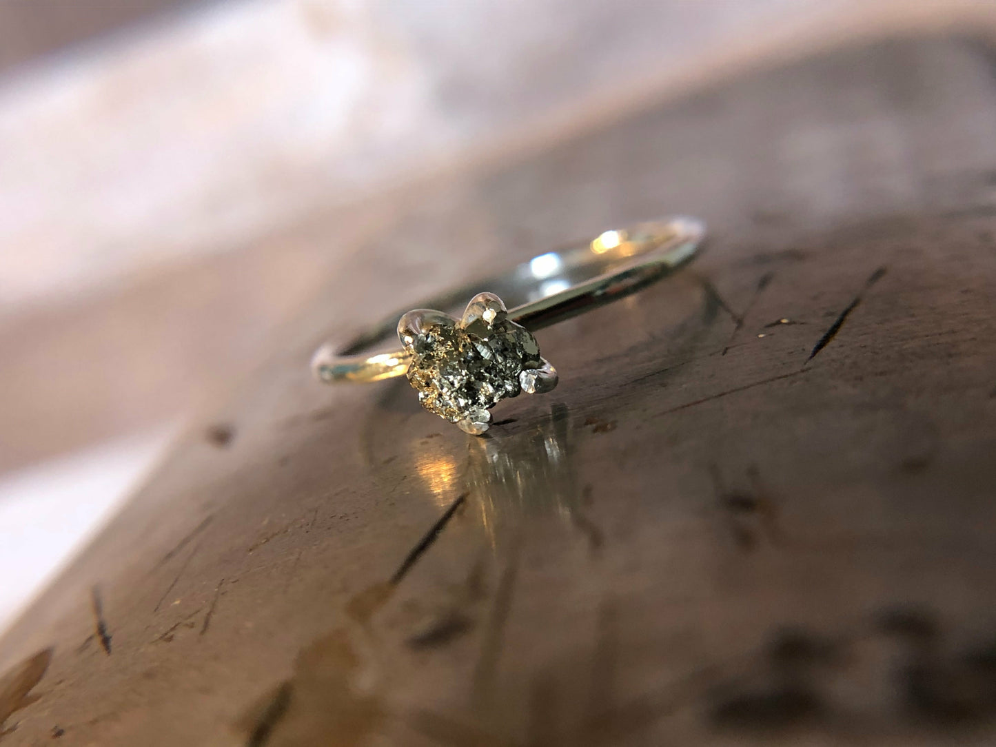 Small single band ring with raw pyrite prong set