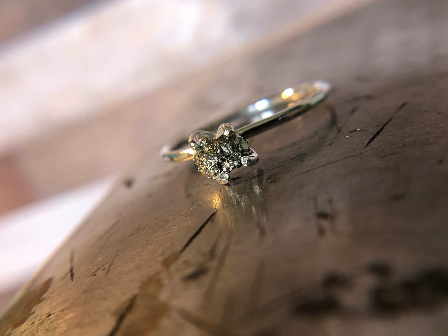 Small single band ring with raw pyrite prong set