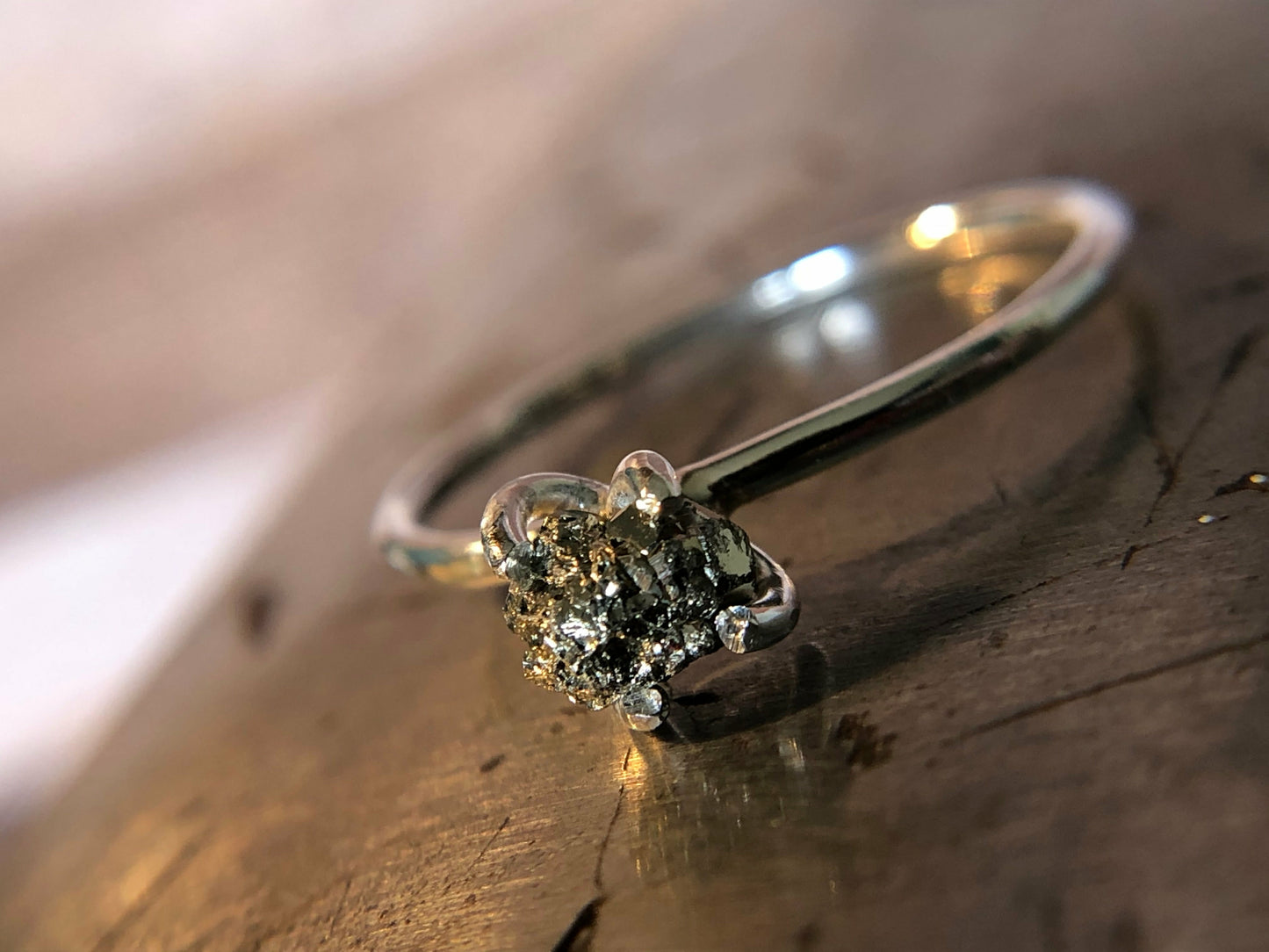 Small single band ring with raw pyrite prong set
