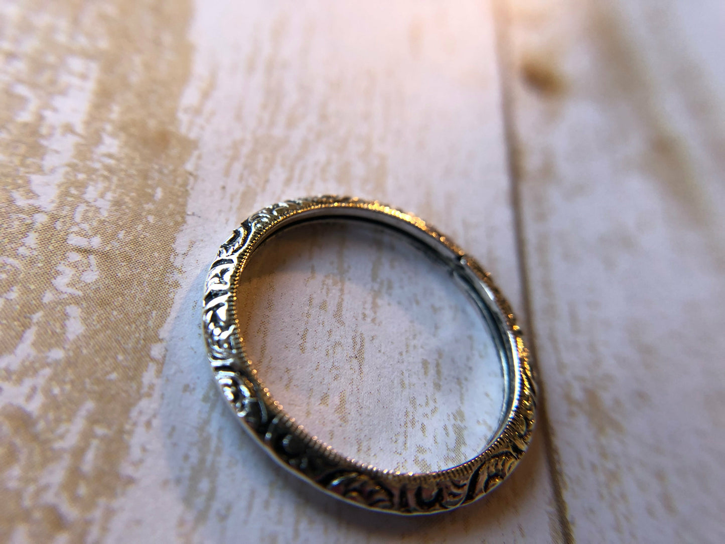 Small ring with one band with swirl inlay, perfect for stacking.