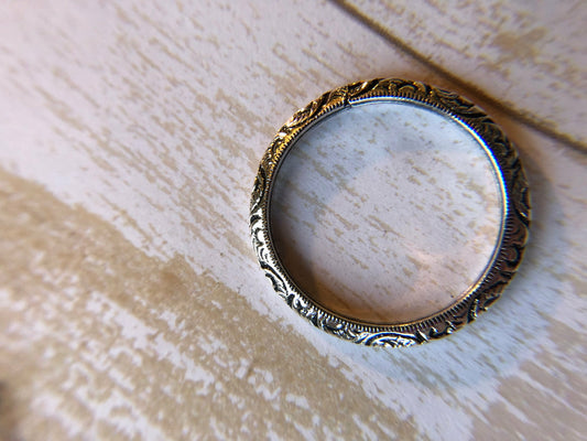 Small ring with one band with swirl inlay, perfect for stacking.