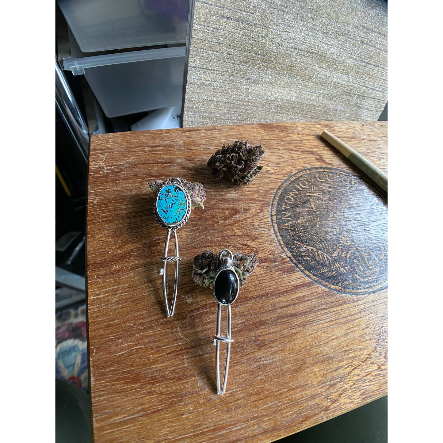 Black two prong hair fork with onyx set upon the top.