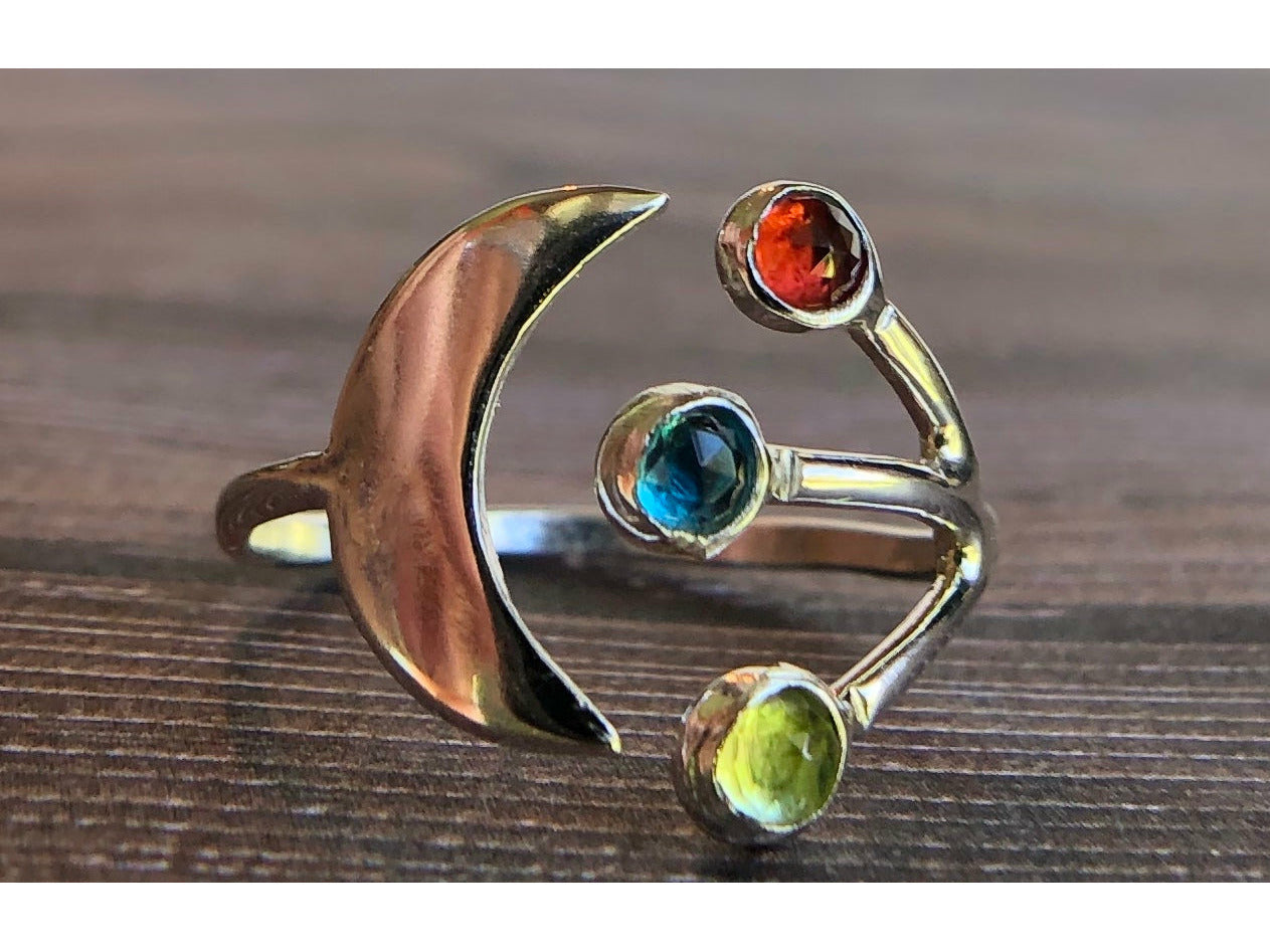 Adjustable ring with moon on one side and three stones of your choice on the opposite band.