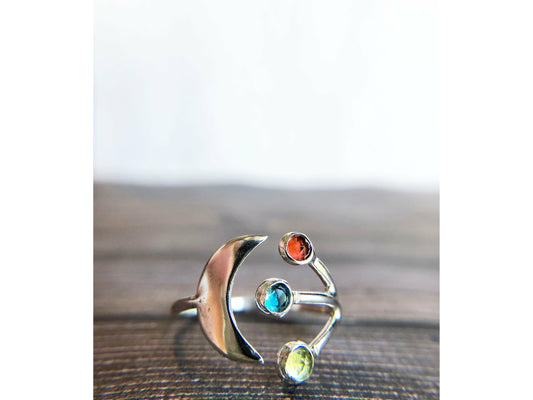 Adjustable ring with moon on one side and three stones of your choice on the opposite band.