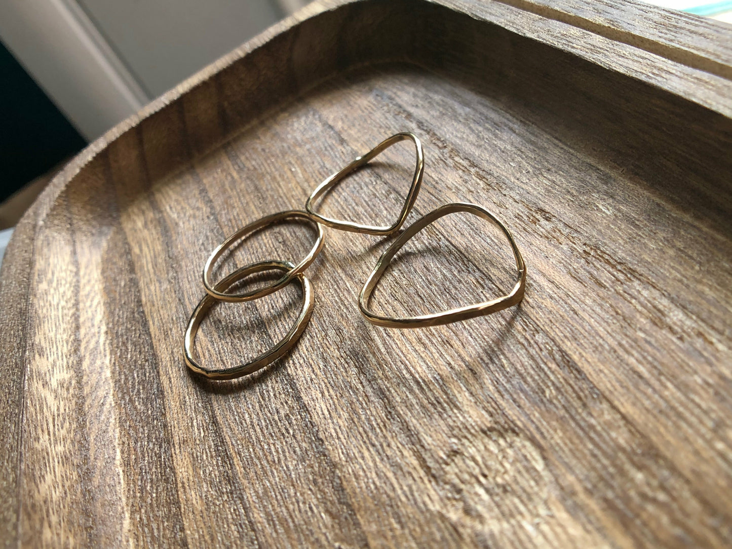 small gold filled rings with one ring a chevron