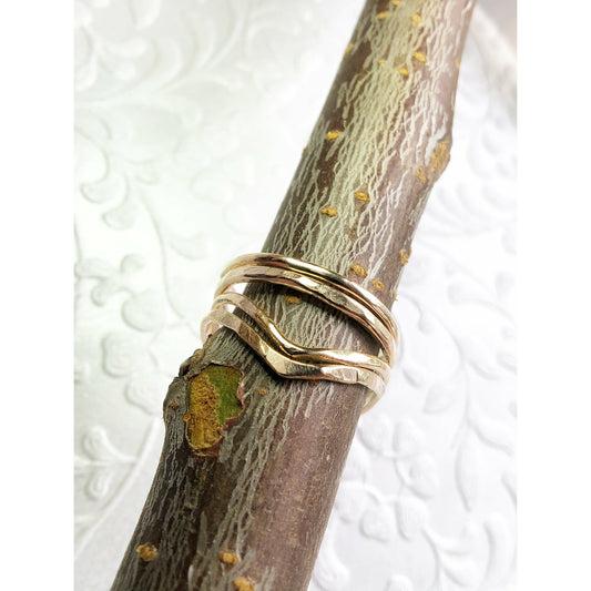 small gold filled rings with one ring a chevron