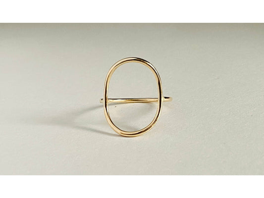 Gold filled oval ring with band attaching to either side of oval