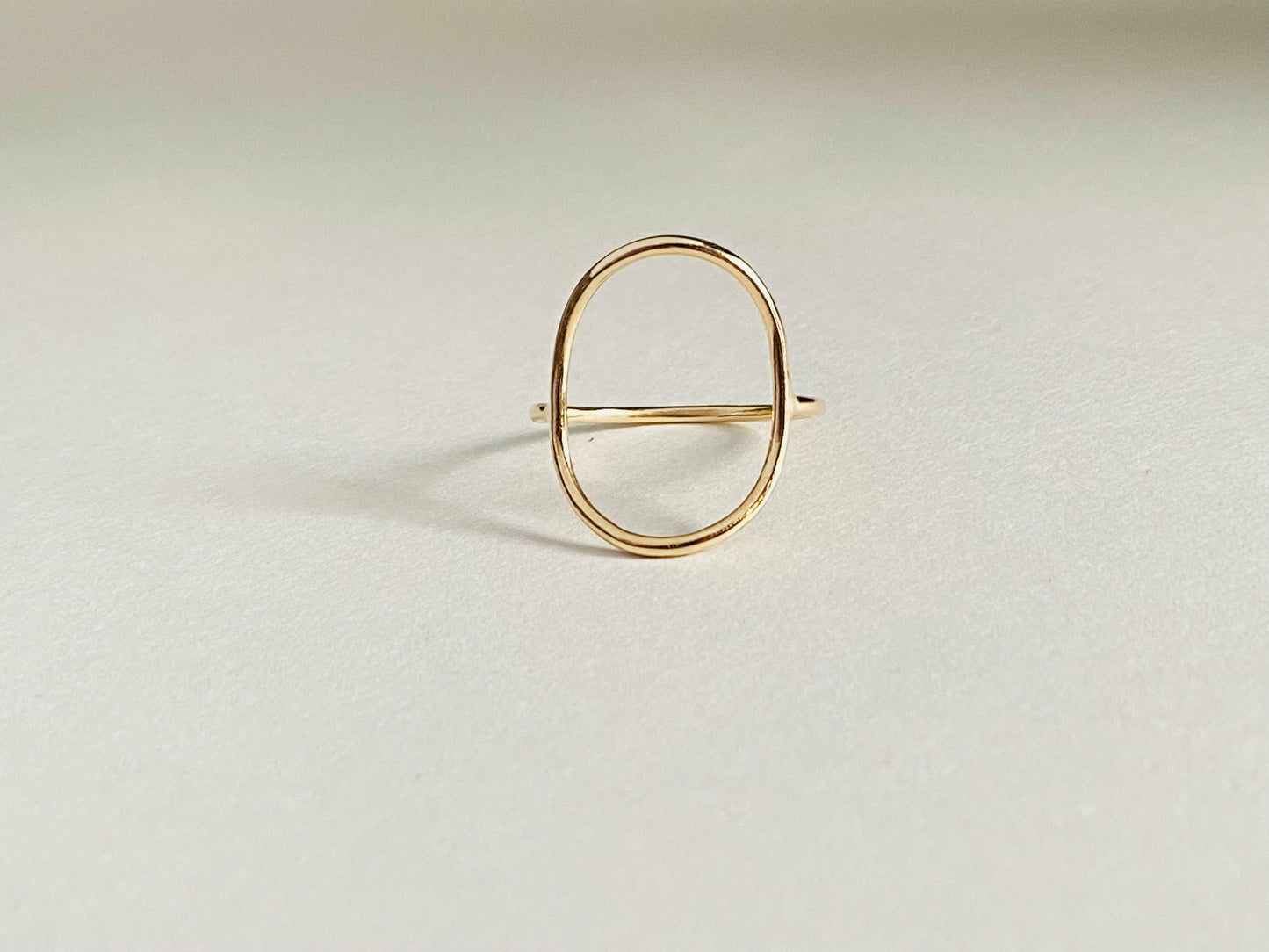 Gold filled oval ring with band attaching to either side of oval