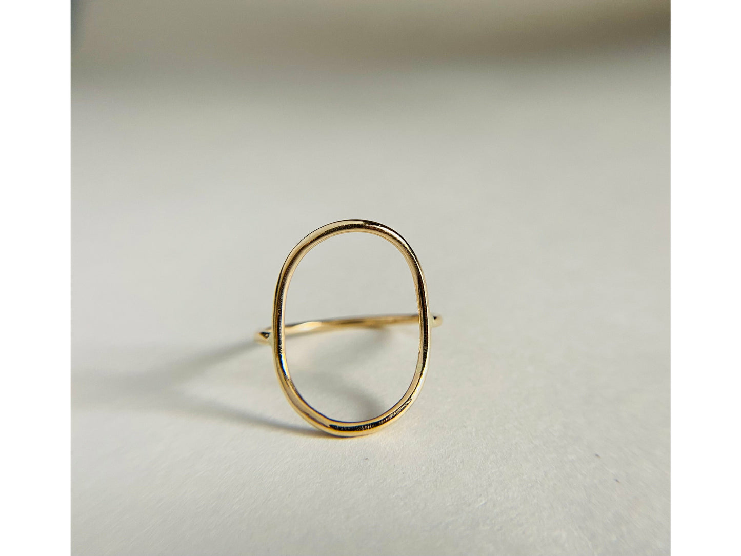 Gold filled oval ring with band attaching to either side of oval