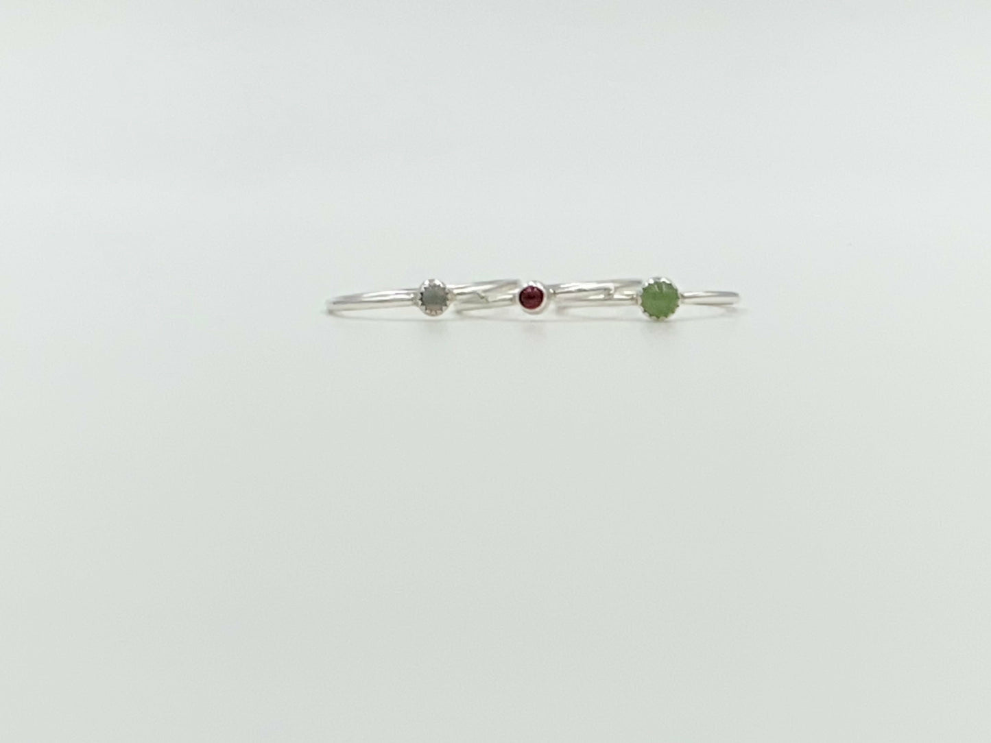 Small stackable ring mounted on a round wire. Your choice of stone.
