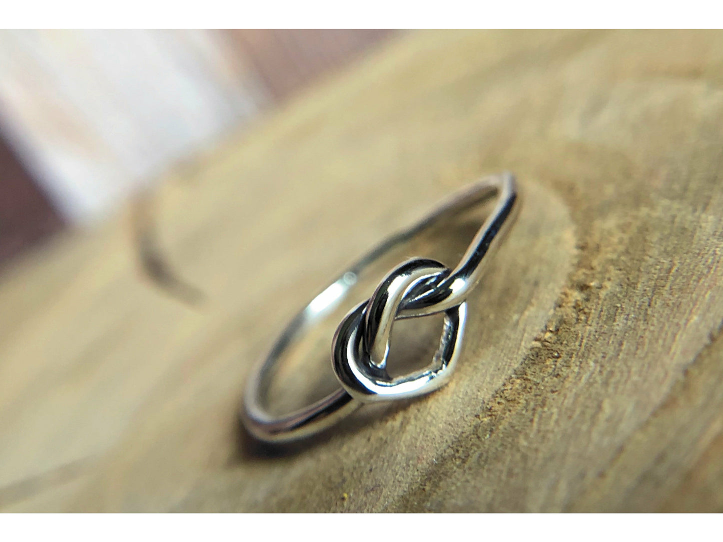 small heart formed out of silver, one continous piece of silver.