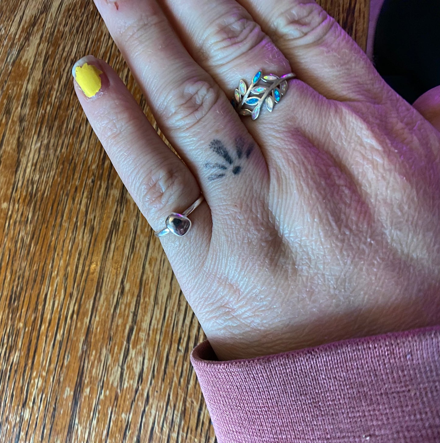 Organic sterling silver ring with large bump of silver resembling a raindrop as the focal, super simple straight band.