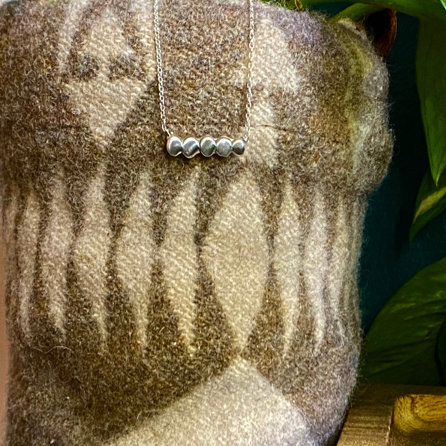 Minimal necklaces with your choice of small pieces of silver hammered out and soldered together to make a small circle line across the necklace.