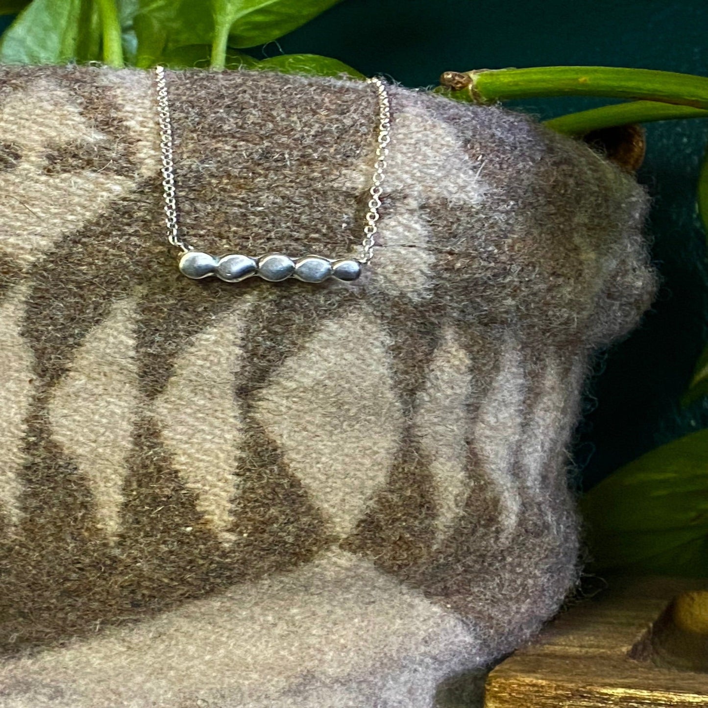 Minimal necklaces with your choice of small pieces of silver hammered out and soldered together to make a small circle line across the necklace.