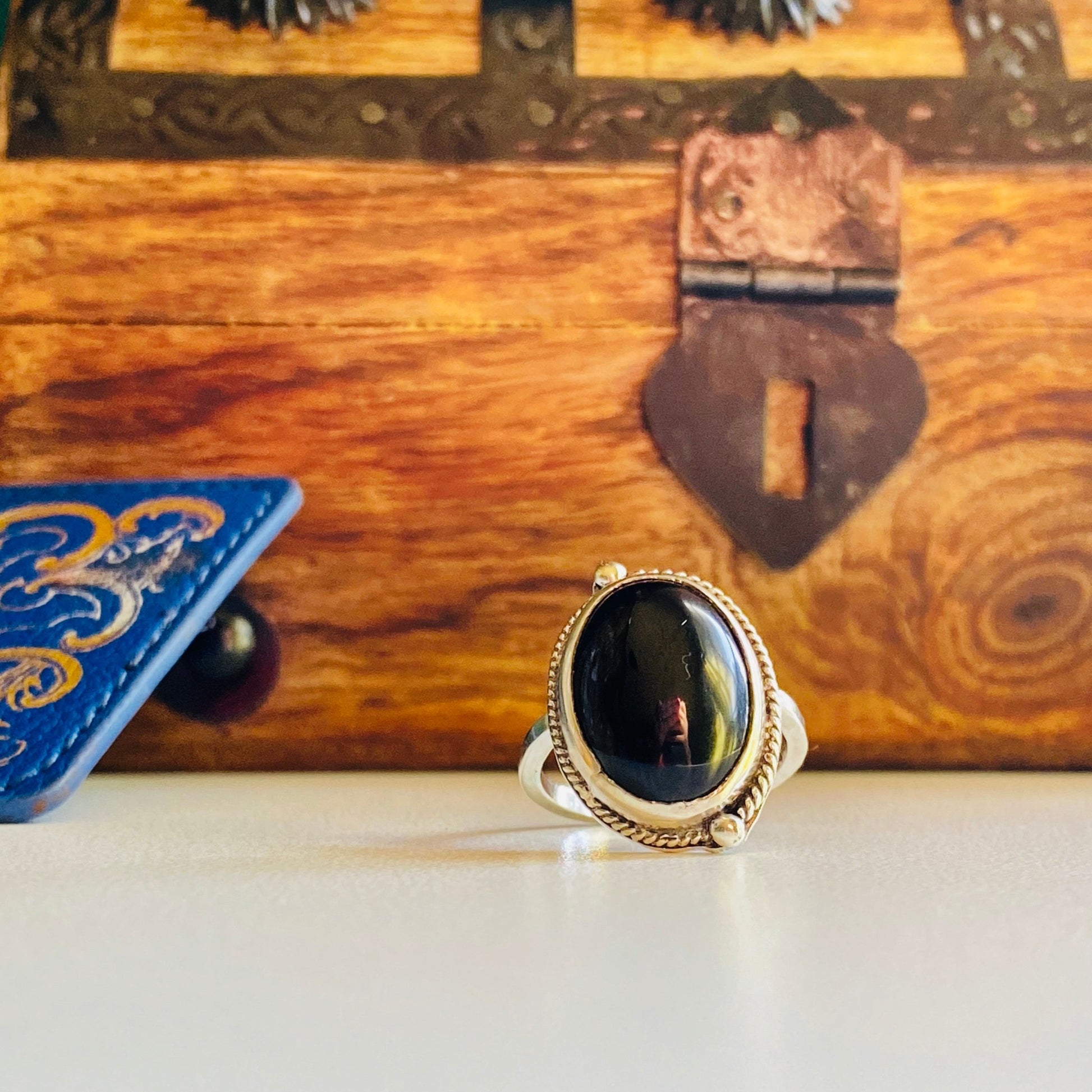 sterling silver onyx statement ring, onyx cabachon with half twisted wire with granulation (tiny dots) offset, statement ring, simple band