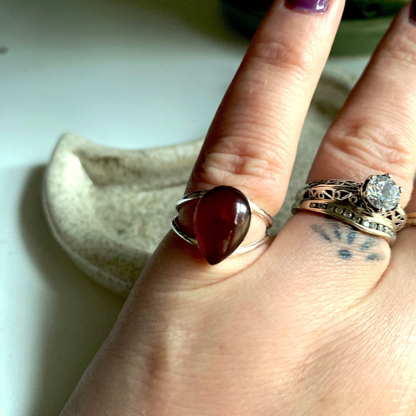 Split shank red pear shaped stone mounted with split shank sterling silver wire.