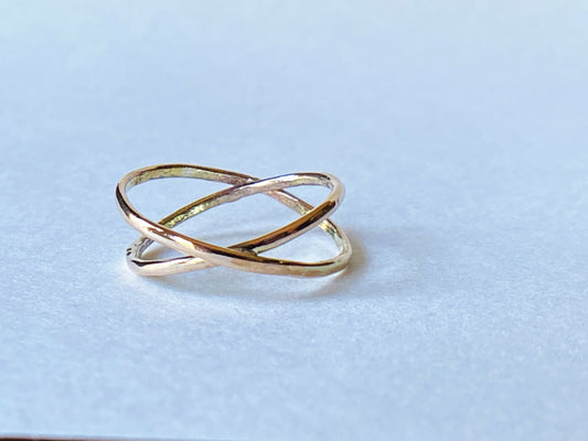 Two gold filled rings cross to make an x shape or a "twist"