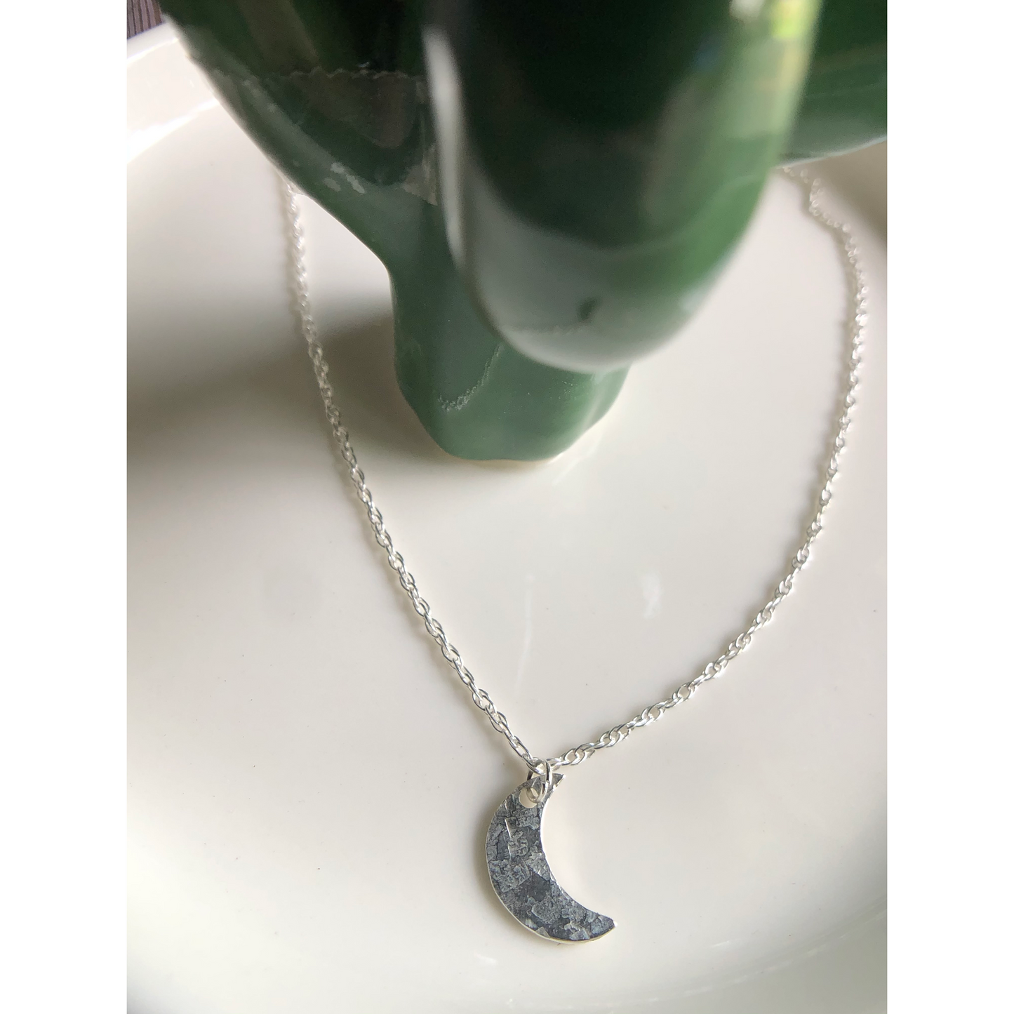 Simple silver chain with sterling silver cut moon mounted on the middle