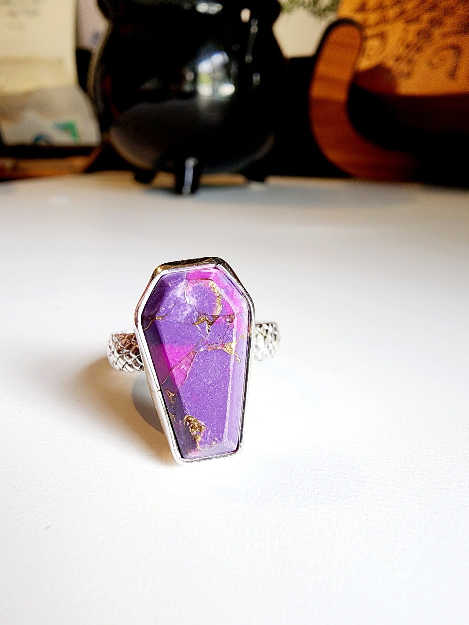 Purple with gold speckled coffin stone shaped ring with snakeskin like textured band