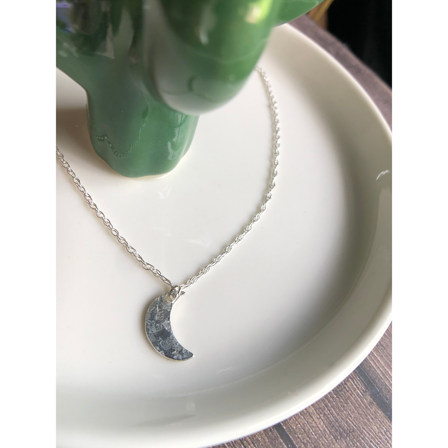 Simple silver chain with sterling silver cut moon mounted on the middle