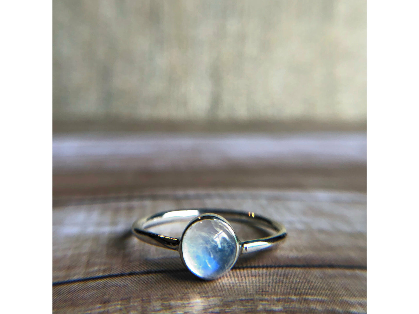small moonstone ring with simple band. Bezel set.