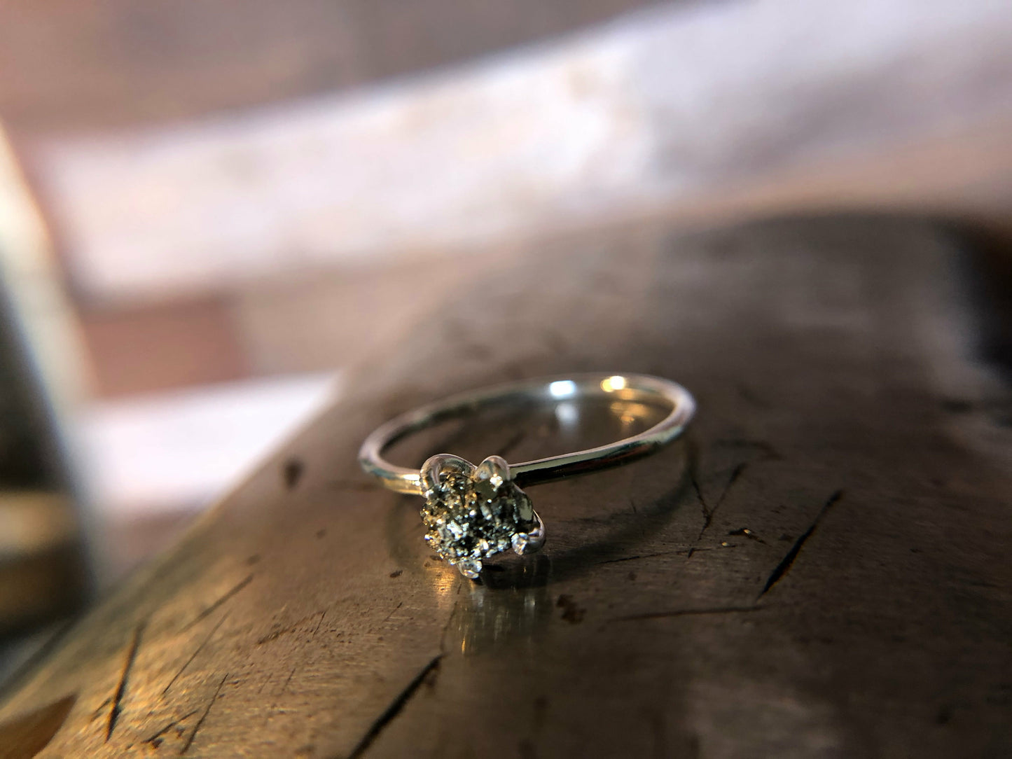 Small single band ring with raw pyrite prong set
