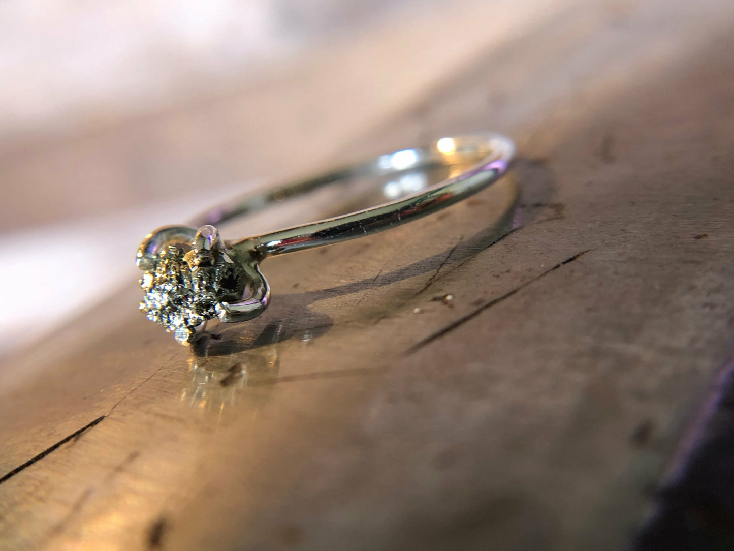 Small single band ring with raw pyrite prong set