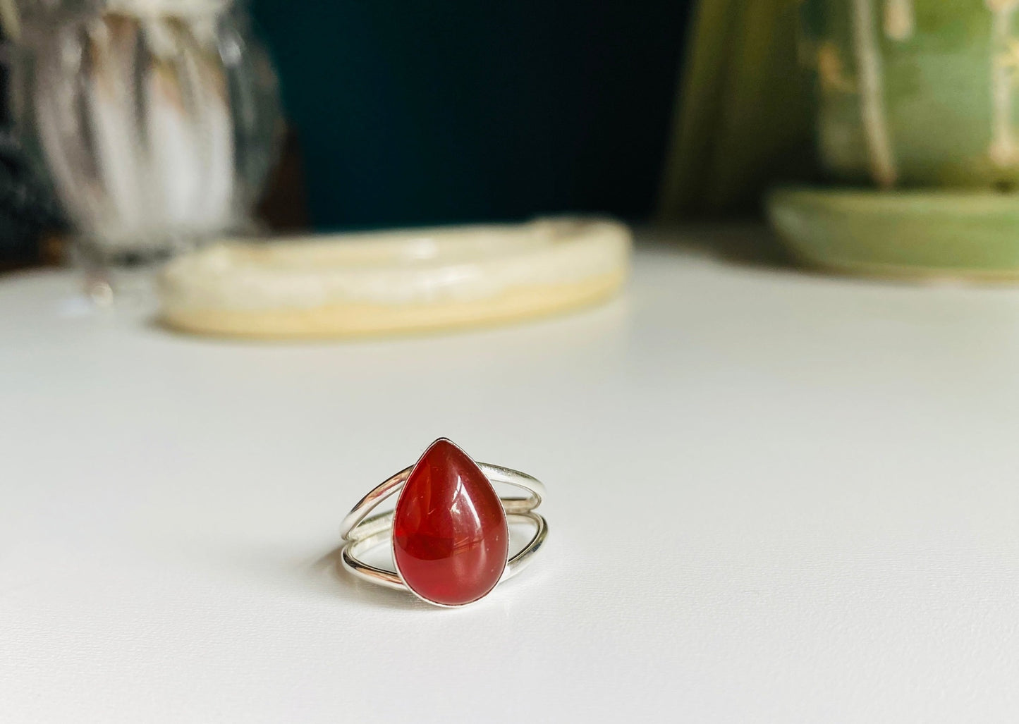 Split shank red pear shaped stone mounted with split shank sterling silver wire. 
